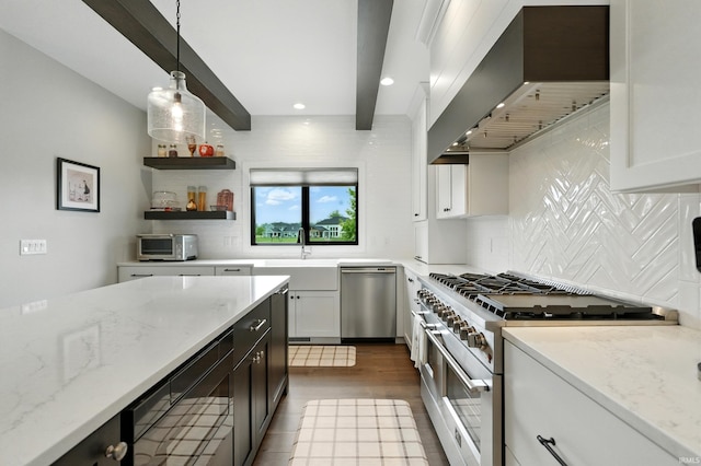 13176 Malfini Trl, Fort Wayne, IN 46845 - kitchen with appliances with stainless steel finishes, wall chimney exhaust hood, decorative backsplash, light stone countertops, and decorative light fixtures