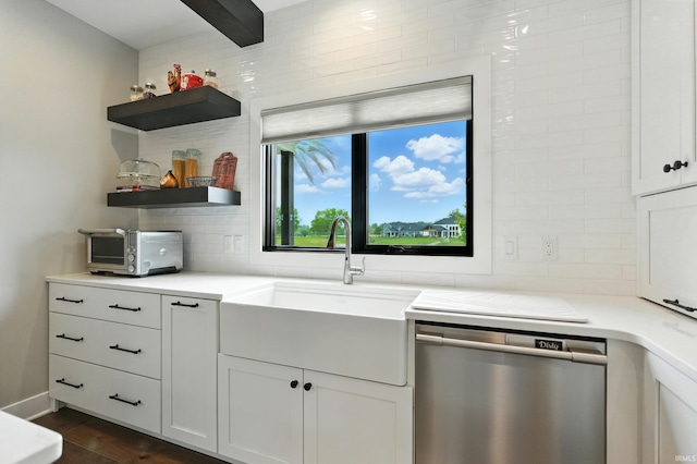 13176 Malfini Trl, Fort Wayne, IN 46845 - kitchen with stainless steel dishwasher, backsplash, light countertops, dark wood-style floors, and white cabinetry