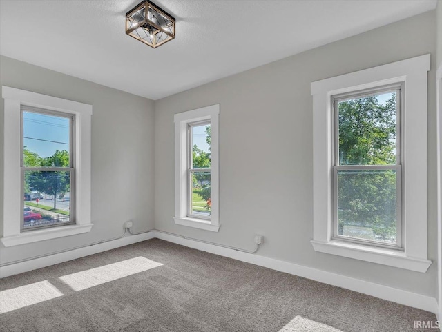 439 E Wayne St, Fort Wayne, IN 46802 - carpeted spare room featuring baseboards