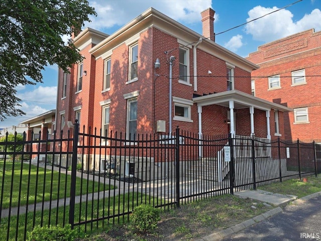 439 E Wayne St, Fort Wayne, IN 46802 - view of building exterior with a fenced front yard