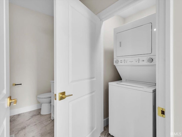439 E Wayne St, Fort Wayne, IN 46802 - laundry room with stacked washer / dryer and marble finish flooring