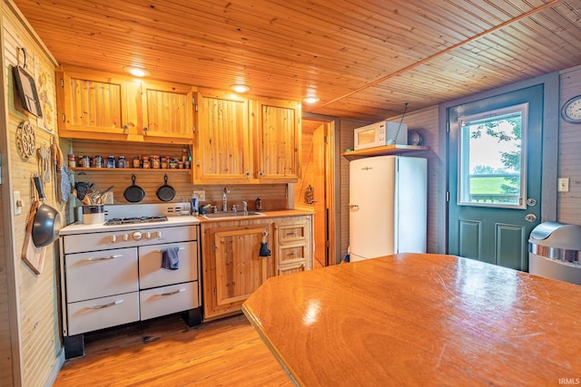 5142 W Corly Ln, Silver Lake, IN 46982 - kitchen featuring freestanding refrigerator, light wood-type flooring, light countertops, wooden ceiling, and wooden walls