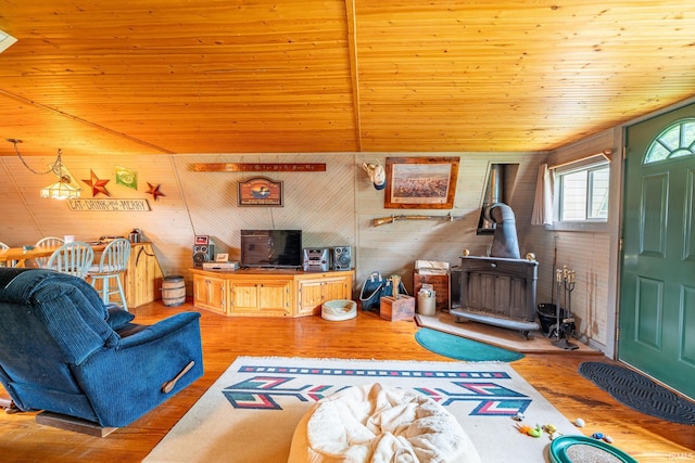 5142 W Corly Ln, Silver Lake, IN 46982 - living area with a wood stove, wood finished floors, wood ceiling, and wood walls