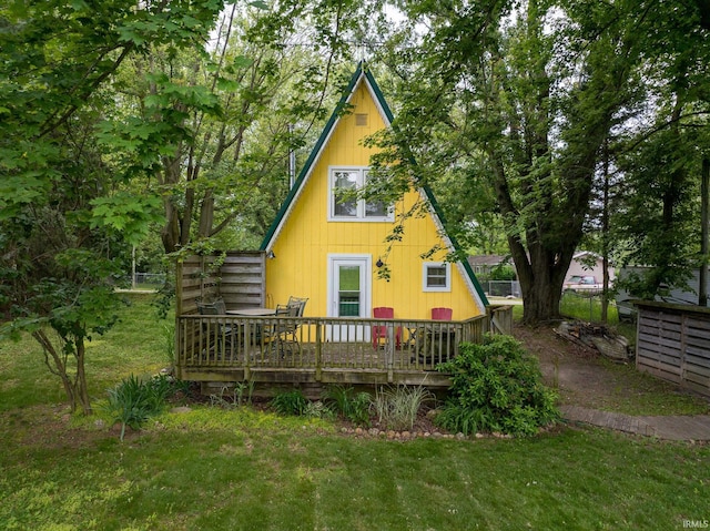 5142 W Corly Ln, Silver Lake, IN 46982 - back of property with a deck and a lawn