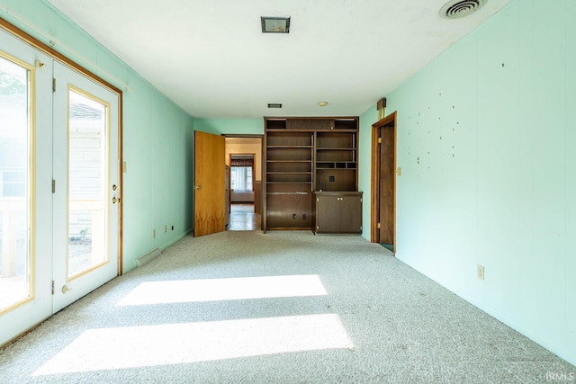 644 W Ladd Ave, Bloomington, IN 47403 - unfurnished bedroom with carpet flooring and access to exterior