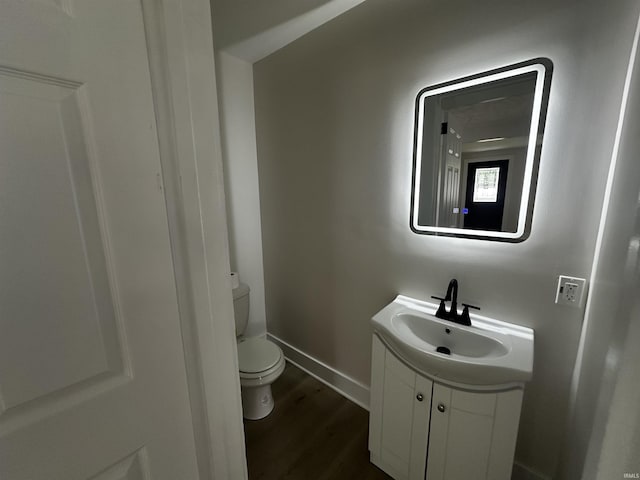 1014 E Donald St, South Bend, IN 46613 - half bath featuring vanity and wood finished floors