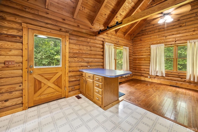5818 Prophets Rock Rd, West Lafayette, IN 47906 - kitchen with a peninsula, healthy amount of natural light, wooden ceiling, brown cabinets, and a ceiling fan