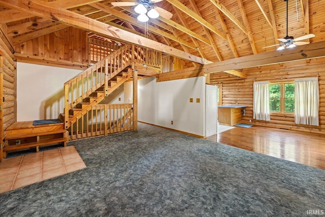 5818 Prophets Rock Rd, West Lafayette, IN 47906 - unfurnished living room featuring a ceiling fan, carpet flooring, log walls, a wooden ceiling with exposed beams, and high vaulted ceiling