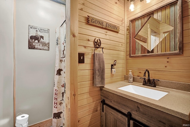 10154 W Rock E Rd, Bloomington, IN 47403 - bathroom with wood walls, vanity, and a shower with shower curtain