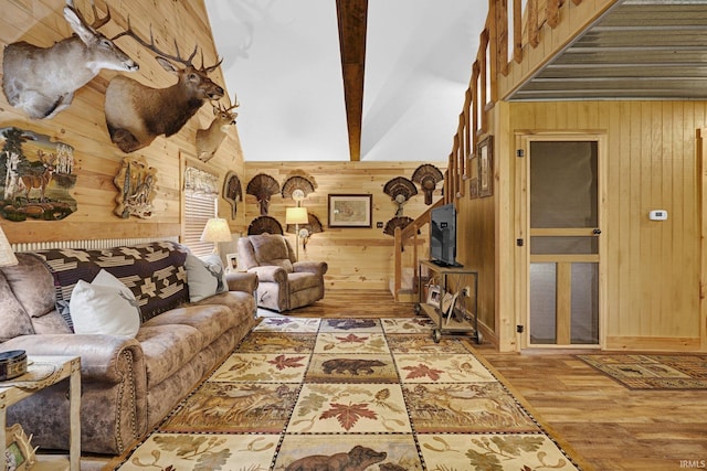 10154 W Rock E Rd, Bloomington, IN 47403 - living room with wooden walls, light wood-style flooring, beamed ceiling, and high vaulted ceiling