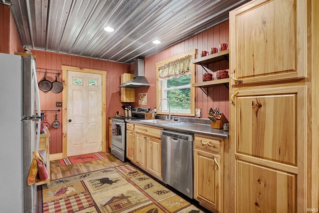 10154 W Rock E Rd, Bloomington, IN 47403 - kitchen with appliances with stainless steel finishes, wall chimney range hood, dark countertops, recessed lighting, and wooden walls