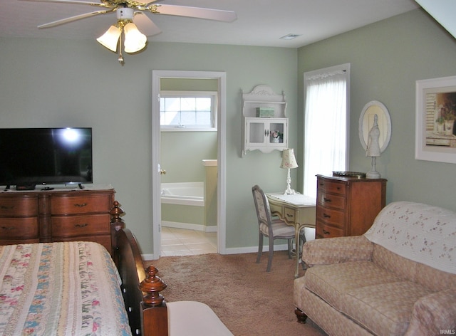 2622 Oak Trail Dr, Newburgh, IN 47630 - bedroom featuring light carpet, connected bathroom, light tile patterned floors, and a ceiling fan