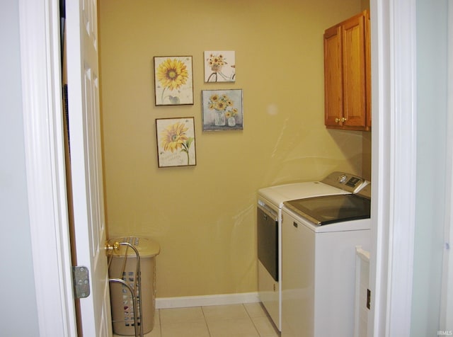 2622 Oak Trail Dr, Newburgh, IN 47630 - laundry area featuring washer and clothes dryer, cabinet space, and light tile patterned floors