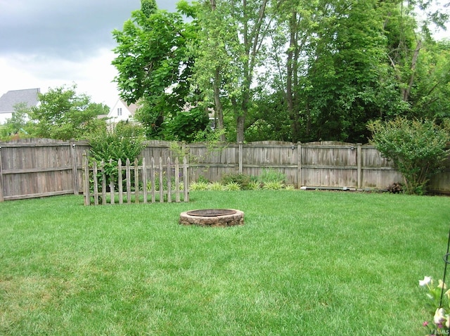 2622 Oak Trail Dr, Newburgh, IN 47630 - fenced backyard featuring an outdoor fire pit