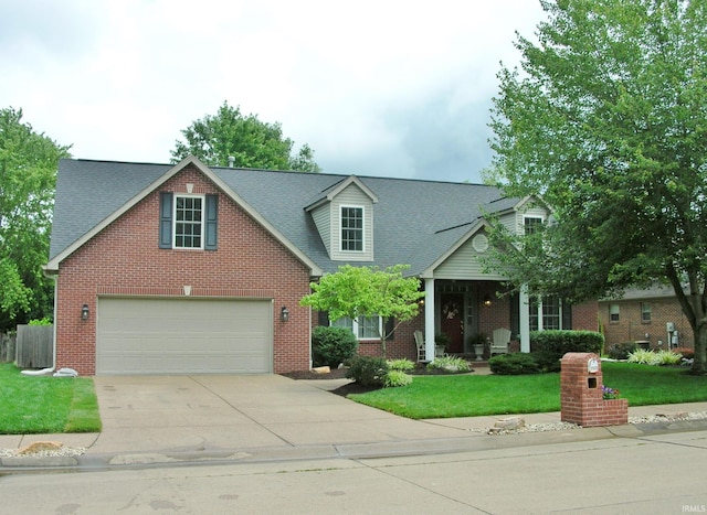 2622 Oak Trail Dr, Newburgh, IN 47630 - view of front of house featuring concrete driveway, brick siding, a front lawn, and a shingled roof