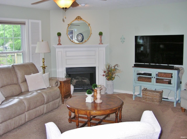 2622 Oak Trail Dr, Newburgh, IN 47630 - living room with carpet, ceiling fan, and a fireplace with flush hearth