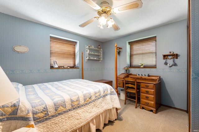 1105 N Buckeye Rd, Muncie, IN 47304 - carpeted bedroom featuring wallpapered walls, a closet, and a ceiling fan