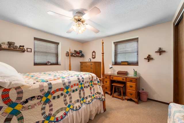 1105 N Buckeye Rd, Muncie, IN 47304 - bedroom featuring light carpet, a ceiling fan, a closet, and a textured ceiling