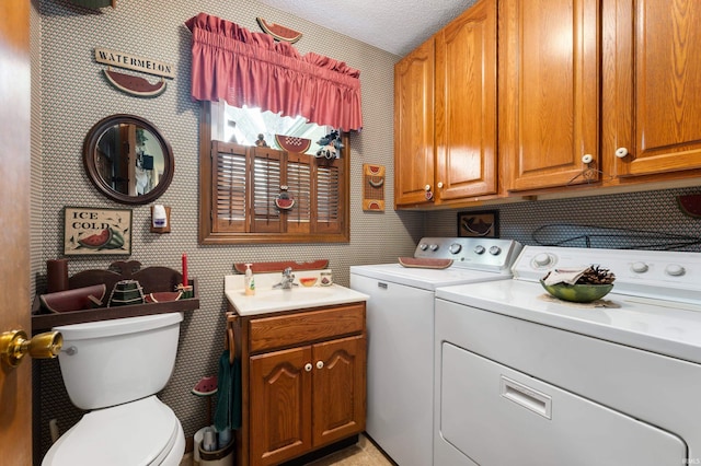1105 N Buckeye Rd, Muncie, IN 47304 - laundry area featuring separate washer and dryer and wallpapered walls