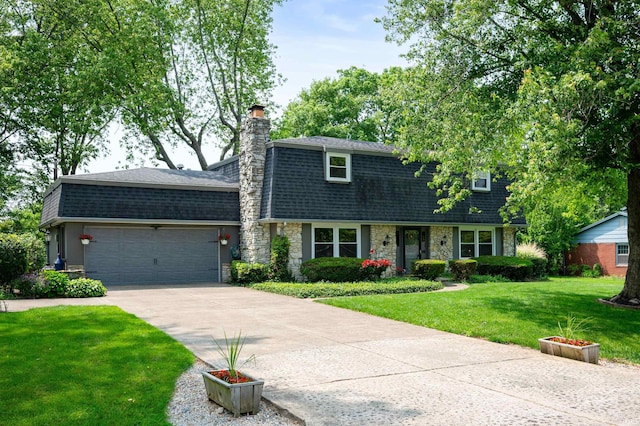 1105 N Buckeye Rd, Muncie, IN 47304 - dutch colonial with roof with shingles, driveway, a garage, a front yard, and mansard roof
