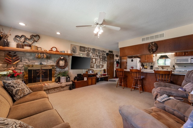 1105 N Buckeye Rd, Muncie, IN 47304 - living room with carpet floors, ceiling fan, and a fireplace