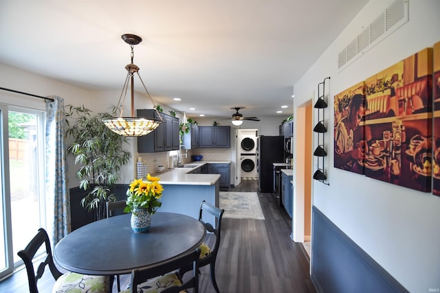 7366 Capri Ct, Newburgh, IN 47630 - dining area with stacked washer / dryer, dark wood-style flooring, recessed lighting, and a ceiling fan
