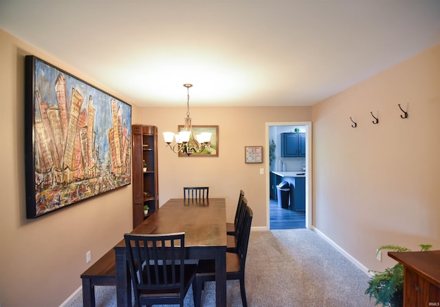 7366 Capri Ct, Newburgh, IN 47630 - dining area with a chandelier and carpet flooring