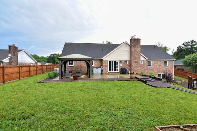 7366 Capri Ct, Newburgh, IN 47630 - back of house with a gazebo, a patio, a fenced backyard, a chimney, and brick siding