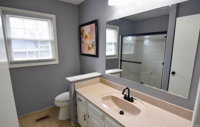 7366 Capri Ct, Newburgh, IN 47630 - bathroom featuring a shower with door, healthy amount of natural light, vanity, and tile patterned floors