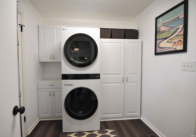 7366 Capri Ct, Newburgh, IN 47630 - laundry room featuring cabinet space, stacked washing machine and dryer, and dark wood-style flooring