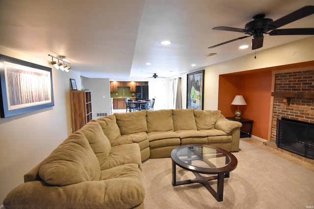7366 Capri Ct, Newburgh, IN 47630 - living area with ceiling fan, a brick fireplace, and recessed lighting
