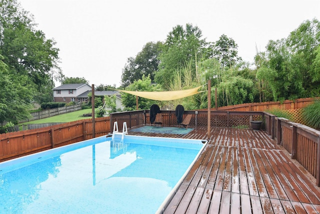 7366 Capri Ct, Newburgh, IN 47630 - view of swimming pool with a wooden deck, a fenced backyard, and view of scattered trees