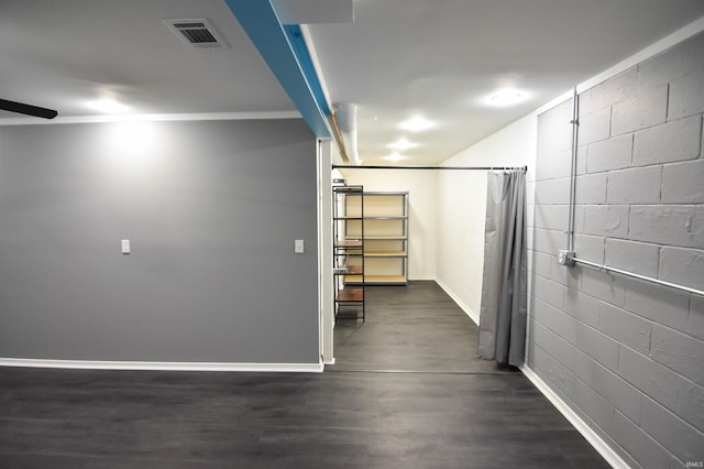 7366 Capri Ct, Newburgh, IN 47630 - hallway featuring concrete block wall and dark wood-style flooring