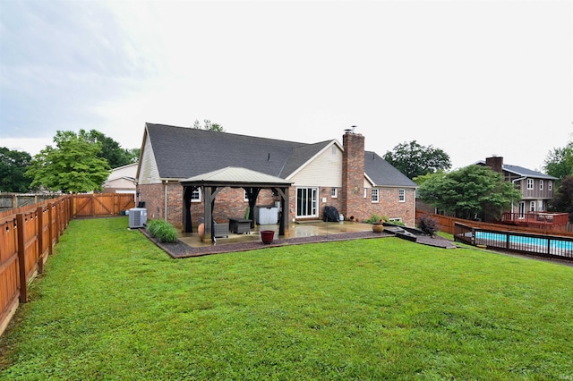 7366 Capri Ct, Newburgh, IN 47630 - back of property featuring a gazebo, a patio, a fenced backyard, a chimney, and brick siding