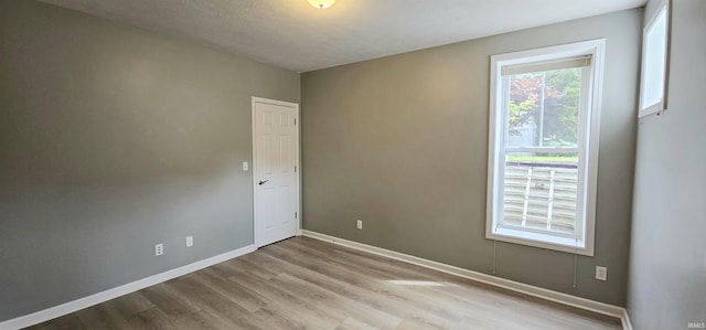 1648 S Ira St, Bloomington, IN 47401 - unfurnished room with wood finished floors and baseboards