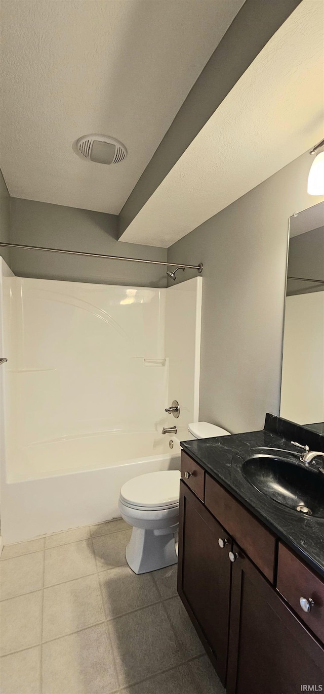1648 S Ira St, Bloomington, IN 47401 - bathroom with vanity, shower / washtub combination, tile patterned floors, and a textured ceiling