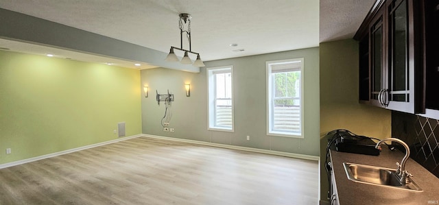 1648 S Ira St, Bloomington, IN 47401 - unfurnished dining area featuring light wood-style floors and recessed lighting