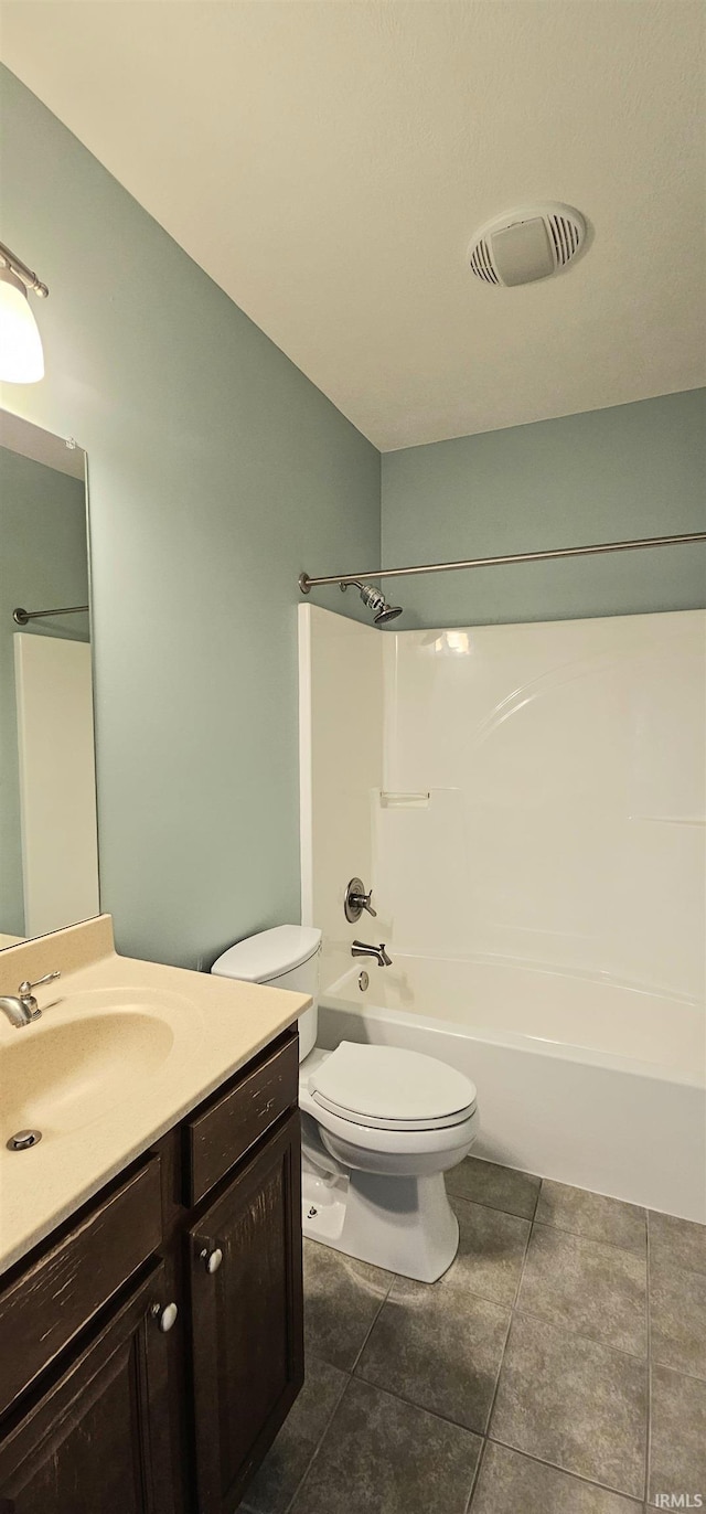 1648 S Ira St, Bloomington, IN 47401 - bathroom with vanity, tile patterned flooring, and washtub / shower combination