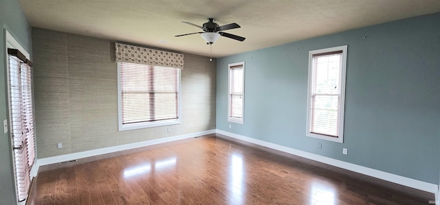 1648 S Ira St, Bloomington, IN 47401 - empty room featuring a ceiling fan and wood finished floors