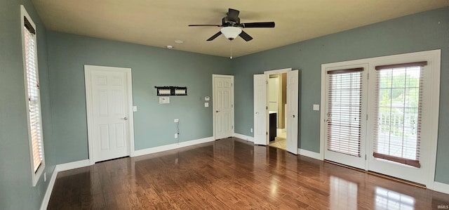 1648 S Ira St, Bloomington, IN 47401 - unfurnished bedroom featuring wood finished floors, access to exterior, ensuite bathroom, and a ceiling fan