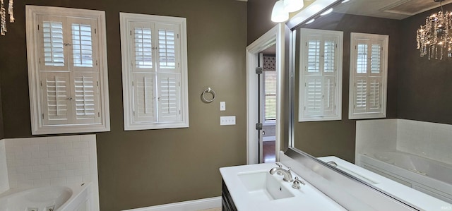 1648 S Ira St, Bloomington, IN 47401 - full bath with a bath, vanity, and a chandelier
