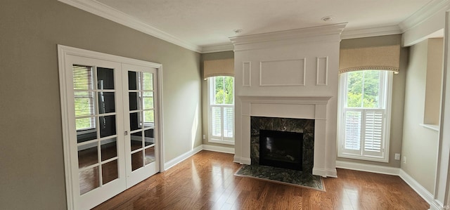 1648 S Ira St, Bloomington, IN 47401 - unfurnished living room with french doors, wood finished floors, healthy amount of natural light, a premium fireplace, and ornamental molding