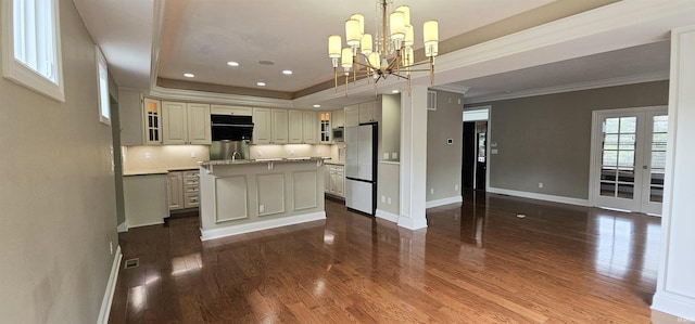 1648 S Ira St, Bloomington, IN 47401 - kitchen with stainless steel appliances, dark wood-style flooring, a chandelier, a center island, and ornamental molding