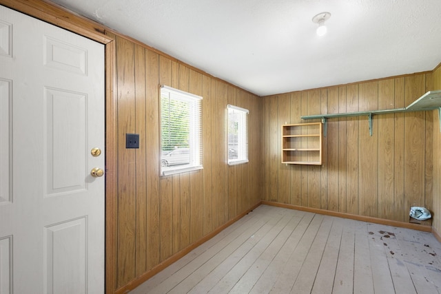 605 N 7th St, Goshen, IN 46528 - unfurnished room featuring light wood-style flooring and wood walls