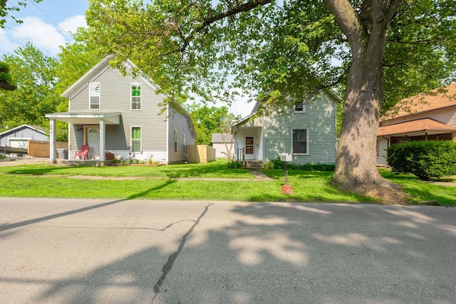605 N 7th St, Goshen, IN 46528 - traditional-style home featuring a front yard and a porch