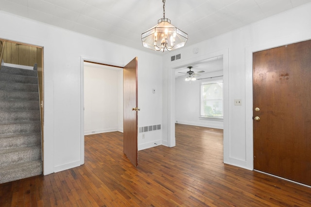 605 N 7th St, Goshen, IN 46528 - foyer with stairs, a chandelier, hardwood / wood-style flooring, and a ceiling fan
