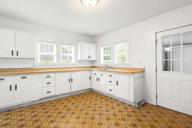 605 N 7th St, Goshen, IN 46528 - kitchen with butcher block countertops and white cabinets