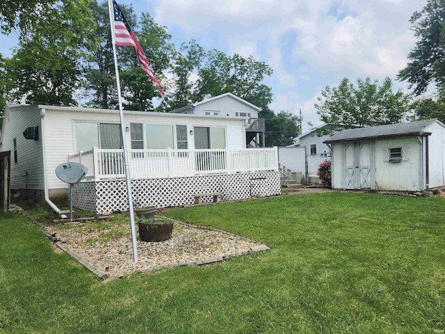 6480 E Mcguire Rd, Churubusco, IN 46723 - rear view of house with a storage unit, a deck, a lawn, and a wall unit AC