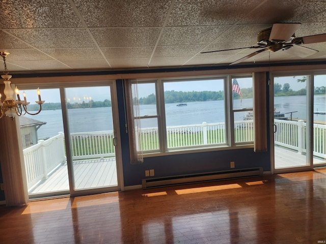 6480 E Mcguire Rd, Churubusco, IN 46723 - spare room with a baseboard heating unit, wood-type flooring, a water view, ceiling fan, and a chandelier