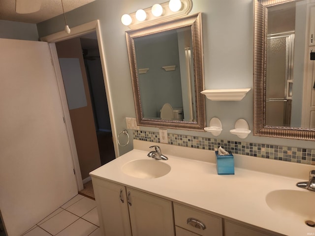 6480 E Mcguire Rd, Churubusco, IN 46723 - full bathroom with backsplash, tile patterned floors, and double vanity